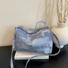 Bolso casual personalizado a la moda y moderno, bolso de hombro y bandolera de nicho para mujer, nuevo bolso tipo cubo texturizado verano 2026