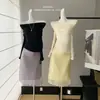 Top de malha de lã lavada, tricotado em máquina Stoll alemã, com toque de nuvem, de um ombro só