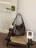 Nueva bolsa de estudiante de gran capacidad para mujer, versátil y texturizada, bolso de un solo hombro bajo el brazo, bolso de mano de cuero suave de moda