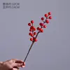 Suministro directo de fábrica Navidad fruta fruta roja fruta rica 12 tenedor fruta roja pequeña fruta de simulación fruta de acebo fruta granada flor de simulación