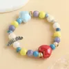 Pulsera de Cerámica con Forma de Corazón de Durazno de Dibujos Animados Lindos para Niñas Pulsera de Perlas de Nicho Macaron Lujo Ligero Joyería Popular Dopamina