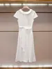 Shenzhen Nanyou ropa de mujer de alta gama nueva colección de verano estilo casual elegante vestido blanco de manga corta adelgazante que ciñe la cintura