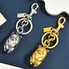 Lindo llavero de oso de metal estilo vintage, accesorio de bolso de nicho de alta gama, colgante de llavero de coche para parejas
