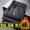 Venta directa de fábrica pantalones casuales para hombre invierno más terciopelo gruesos de pana pantalones de pana para hombre mediana edad sueltos pierna recta pantalones de pana