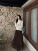 Elegante falda asimétrica reversible Feiyuan para mujer, nueva moda otoño e invierno, versátil, color liso, dobladillo ancho, falda midi