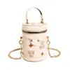 Mini bolso cilíndrico transfronterizo para mujer, nuevo bolso tipo cubo de hombro personalizado, bolso bandolera con cadena para lápiz labial y monedero