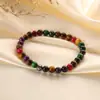 Pulseira de pedra olho de tigre de cor simples da moda pulseira de contas tecida à mão de alto senso nicho joias para senhoras atacado