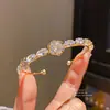 Pulseira Aberta Flor Zircônia Gota d'Água Banhada a Ouro Real 14K Pulseira de Luxo Leve com Senso de Alto Padrão Pulseira Elegante de Nicho para Mulheres