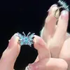 Anillo de apertura de esmalte con gotas de aceite de mariposa azul, estilo de chica dulce con sabor a especias, diseño con personalidad, moda y combina con todo.