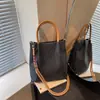 Bolso de mano de cuadros de nicho estilo coreano para mujer, nueva moda primavera 2026, simple y elegante, bolso de hombro y cruzado de alta gama