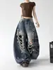 Jeans Azuis Rasgados Feminino Masculino 2026 Verão Novo Estampa de Letras Perna Larga Longo Casual Calças Xintang Fronteira Estoque
