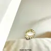 Botón de perla metálica irregular abrigo de traje abrigo de lana cortavientos suéter suéter accesorios decorativos hebilla