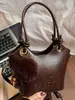 Bolso bandolera tipo cubo retro simple de moda coreana Bolso de hombro de moda nuevo Invierno 2025 Bolso cruzado de nicho para mujer