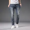 Dropshipping de Roupas Masculinas Xintang 2026 Estilo Coreano Slim Fit Stretch Versátil Verão Jeans Masculino Fino