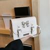 Bolso bandolera pequeño cuadrado estilo casual con lazo sencillo y moderno, combinable con el color de la Academia, 2024, para mujer.