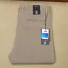 Calça Casual Masculina Série Z Nova Outono e Inverno Quente Grossa Perna Reta Slim Fit Esticável Bolso com Botão Escondido Lã