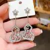 Pendientes de Flor de Calabaza con Zirconia Estilo Súper Brillante Aguja de Plata Moda Personalizada Nicho Temperamento Pendientes de Gama Alta para Mujer