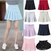 Falda corta estilo coreano falda plisada línea A falda corta de cintura alta para mujer falda plisada de color liso estilo universitario especificaciones al por mayor