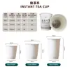 Té en una taza, taza aislada de doble capa espesa con logotipo de té, adecuada para uso comercial y doméstico, vaso de papel desechable con hojas de té incorporadas
