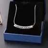 O mesmo design de nicho clássico trevo de quatro folhas padrão sorriso forma não desbota acessórios colar de aço titânio clavícula cadeia