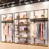Perchero moderno simple de piso estante multicapa simple estante para ropa de mujer soporte de exhibición de ropa de hierro venta al por mayor