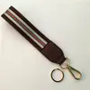Nova Cor com alça de mão em couro PU com alça de braço chaveiro porta-chaves cinto decorativo acessórios alça bolsa de mão curta
