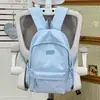 Nova mochila estudantil estilo coreano para meninas, grande capacidade, casual e leve, fresca e doce, adequada para viagens de ensino fundamental e médio
