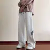 Calça Reta Rasgada Solta Nova Primavera e Outono Design Masculino com Cordão Estilo Americano High Street Calça de Moletom Calça Esportiva Casual Tendência