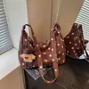 Bolsa Retro de Bolinhas para Mulheres 2026 Nova Moda Bolsa Dumpling Versátil de Ombro/Axila Bolsa Casual para o Dia a Dia para Mulheres
