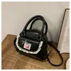 Bolsa tipo cáscara portátil transfronteriza para desplazamientos 2025 Nueva versión coreana Ins Moda de moda Bolso de hombro Bolso cruzado de alta gama