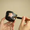 Taza de té de cerámica negra, diseño de lirio con tinta negra pintado a mano, taza de maestro, taza de degustación de té con borde dorado, juego de té de cerámica, taza de té Kung Fu de gran capacidad