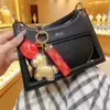 Producto Más Vendido del Año del Caballo: Llavero Colgante para Bolso "Hazte Rico al Instante" Chapado en Oro, un Regalo para Clientes en las Industrias de Seguros y Belleza