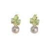 Pendientes versátiles de trébol de cuatro hojas y perla de doble cara, elegantes y modernos, con un toque único y lujoso, pendientes súper brillantes al por mayor