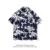 Cuello de solapa 2026 Estilo nuevo Camisa floral para hombre Estilo coreano Holgada Moda Estampada Estilo playero Casual Camisa de manga corta Exportación