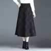 Falda de lana a cuadros de longitud media a la moda para mujer, otoño 2026 nueva de cintura alta, línea A, que cubre la cadera, fluida, moderna
