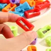 Sacapuntas de color de un agujero para cintura combinación transfronteriza traje de regalo pequeño sacapuntas manual papelería para estudiantes de primaria venta al por mayor