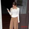 Suéter de punto retorcido estilo retro coreano con bloques de color, mangas largas ajustadas, cuello polo, nuevo modelo 2026, suéter básico para mujer