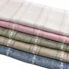 Suministro directo de fábrica al por mayor con diseño de cruz hueca cortina para sofá cojín para sofá mantel tela de poliéster simple y fresco