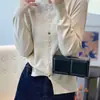 Cardigan de malha casual popular colorido com botões, novo para primavera e outono, gola redonda, moda solta, modelador, top suéter versátil, casaco