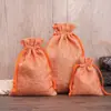 Bolsas de armazenamento multicoloridas com cordão feitas de linho, adequadas para organizar joias, podem ser impressas com logotipos e padrões, e são adequadas para cosméticos, feitas de material compósito imitando linho