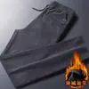 Nuevos pantalones deportivos gruesos de pana para otoño e invierno, cintura elástica, corte recto holgado, pantalones casuales forrados de felpa para hombre