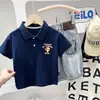 Camisa Polo Infantil Ropa de Verano 2026 Nuevo Estilo para Niños y Niñas, Elegante Camiseta Casual Holgada con Cuello Camisero de Dibujos Animados para Bebés