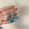 Pendientes colgantes de piedra de pino de estilo nacional retro bohemio europeo y americano transfronterizos, pendientes con borlas huecas, venta directa de fábrica