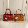 Bolsa de Ombro Estilo Novo Primavera 2026, Bolsa de Mão Quadrada Pequena de Alto Padrão, Casual e Versátil, Bolsa de Ombro Único Transversal