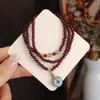 Pulsera de Cristal Natural de Gama Alta Granate Color Vino Tres Círculos Colgante con Hebilla de Seguridad de Jade Pulsera para Mujer al por Mayor
