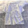 Novo Conjunto Esportivo Casual para Corrida 2025 para Mulheres Verão Estilo Coreano Solto Branco e Estiloso Manga Curta Shorts para Estudantes