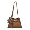 Elegante bolsa feminina 2026 novo modelo, cor sólida com padrão de lichia, bolsa tipo balde da moda, bolsa de ombro e transversal estilosa e versátil