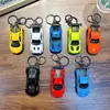 Chaveiro pingente de carro esportivo Huili pingente para bolsa de carro modelo chaveiro liga metálica brinquedo pequeno presente pequeno atacado
