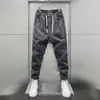 Novas calças casuais masculinas da moda de outono com cós elástico, estilo jogger, modelagem solta, calças de moletom esportivas, vestuário casual masculino