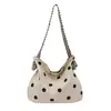 Bolso tote de tendencia coreana de nicho para mujer, bolsa de compras casual de lunares, adecuado para la escuela y el trabajo, bolso de mano de un solo hombro para mujer
